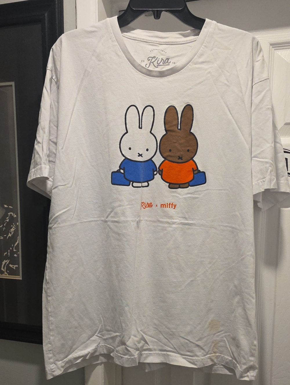 White Graphic Tee with Blue & Orange Characters
